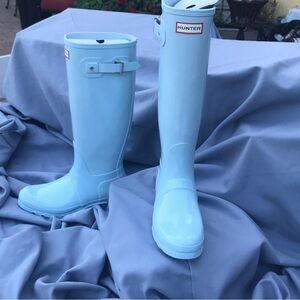 Tall blue hunter boots